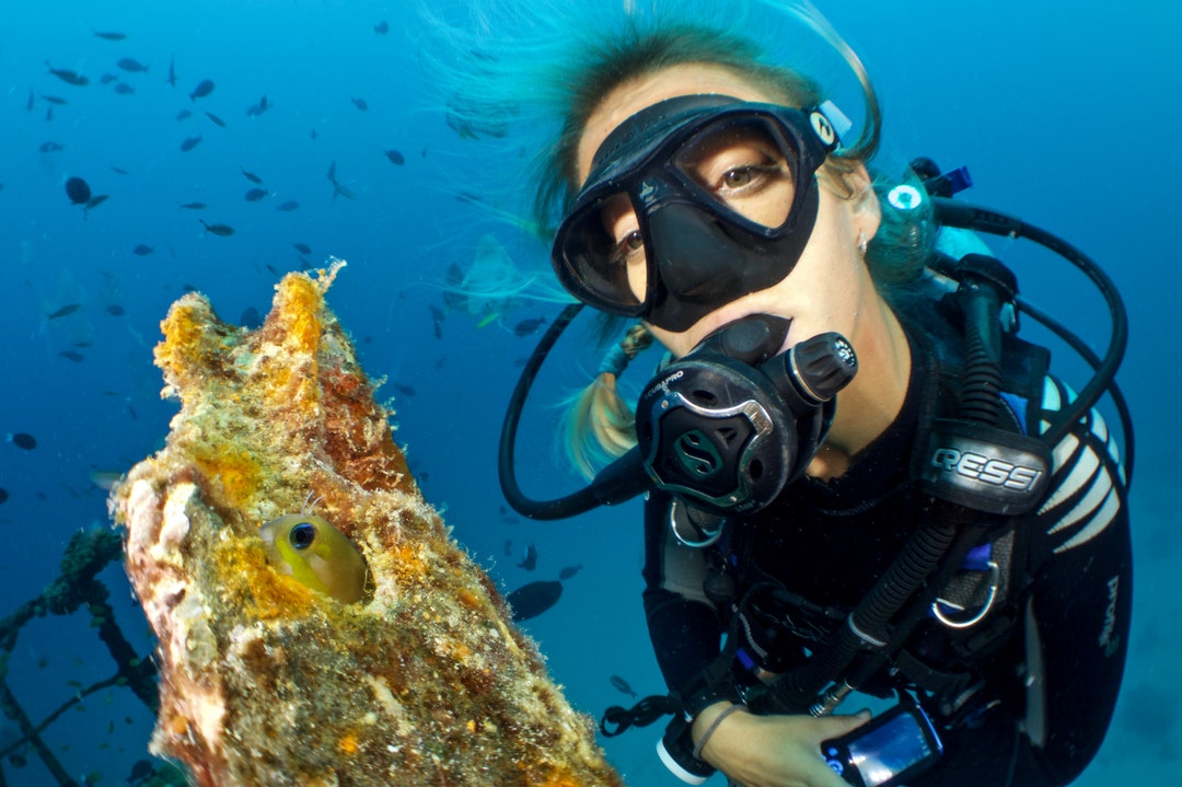 woman using scuba diving gear underwater
