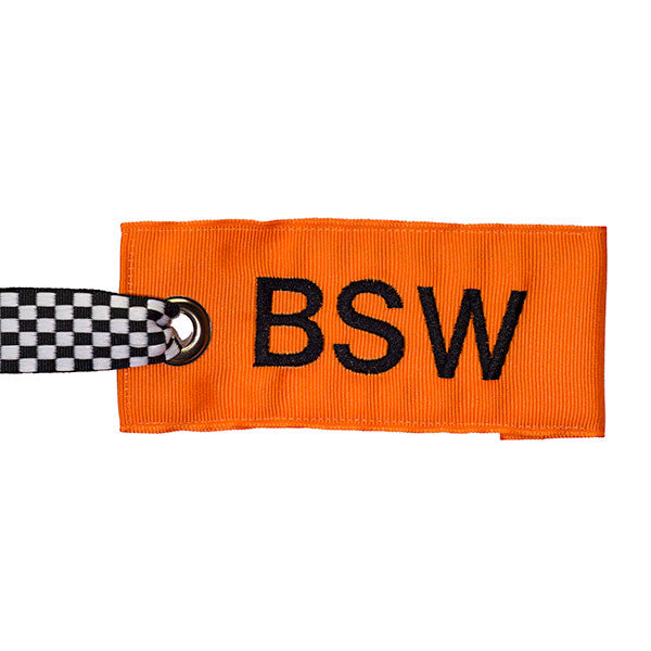 Orange fabric luggage tag with black-white check handle