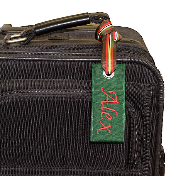 Personalized Hunter Green Luggage Tag shown on suitcase