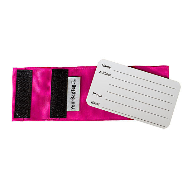 back of pink luggage tag showing address card insert