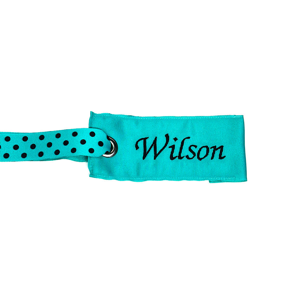 Personalized teal fabric bag tag with black polka dot handle