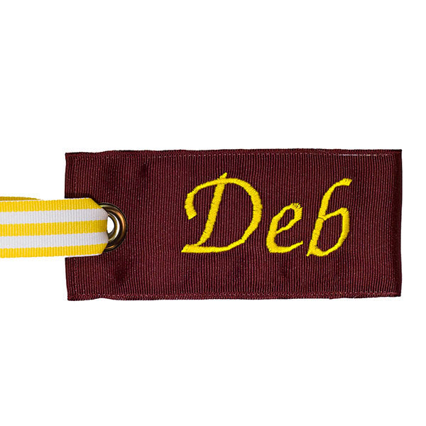 classy maroon luggage tag with yellow text