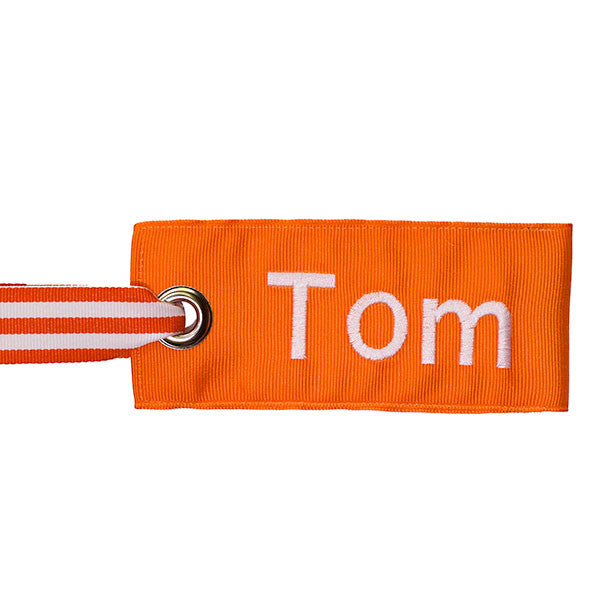 orange bag tag with orange-white stripe handle
