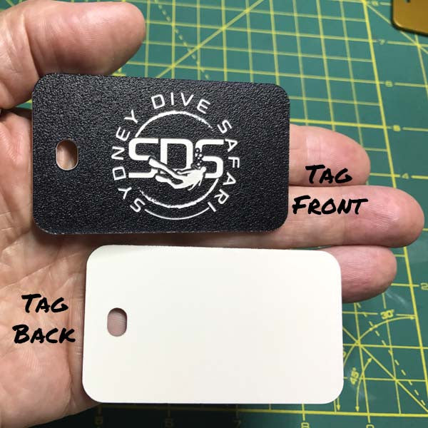 black plastic luggage tag shown front and back of tag