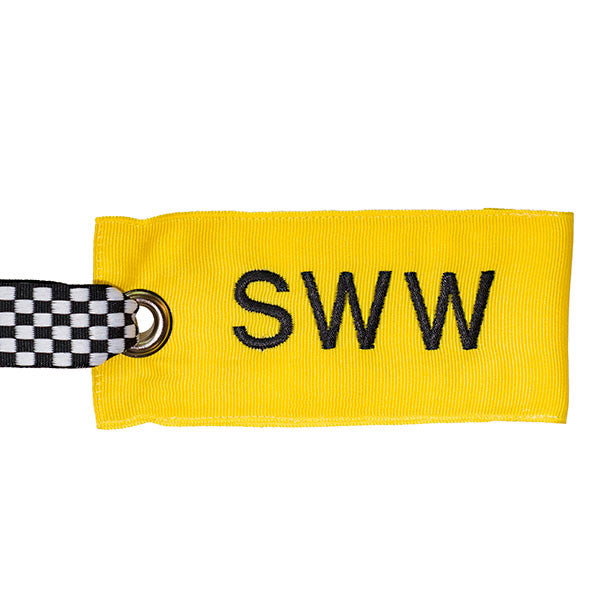 Personalized yellow luggage tag with black text