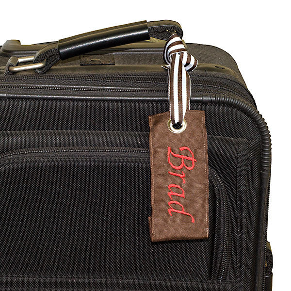 Brown Luggage tag shown black suitcase YourBagTag