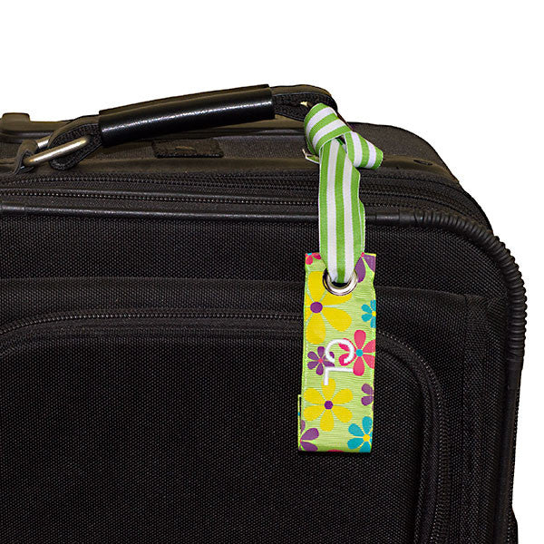 mini luggage tag flower print shown on suitcase