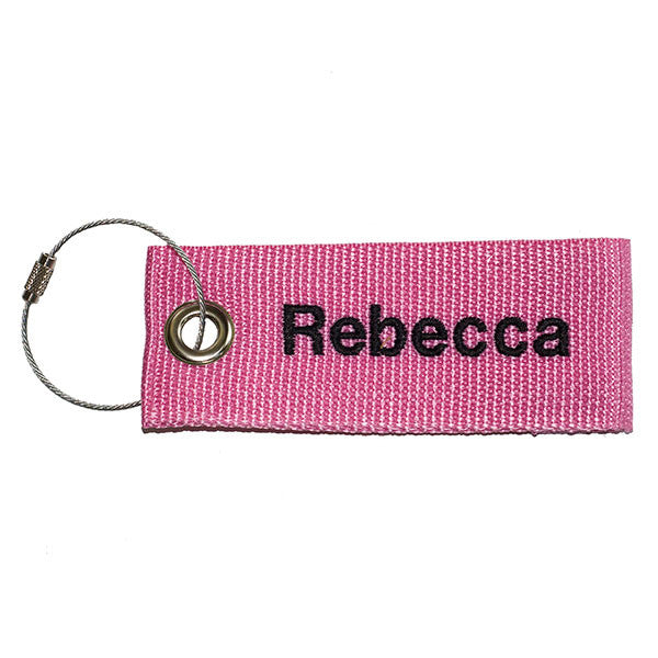 pink extreme luggage tag with black text from YourBagTag