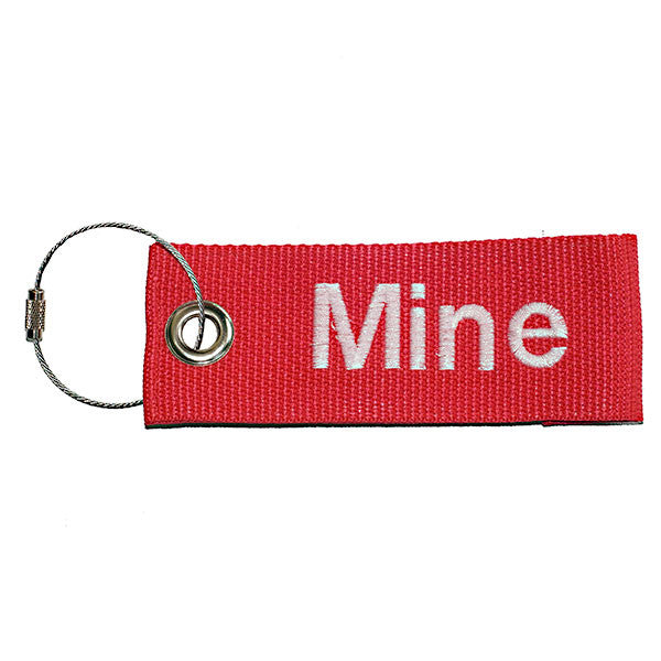 red extreme luggage tag with white text from YourBagTag